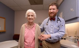 Physician with senior patient