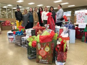 FHC Team donating holiday gifts at Eliada image